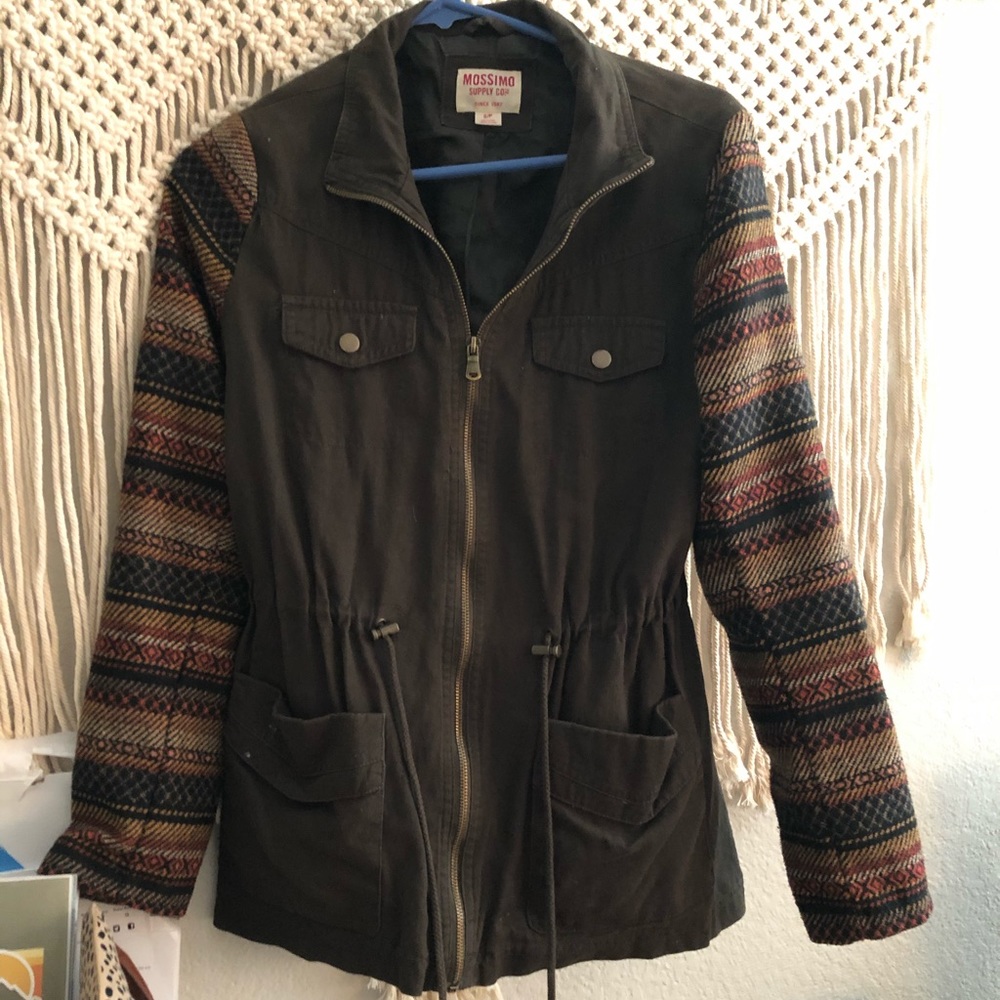 An army green jacket with patterned sleeves